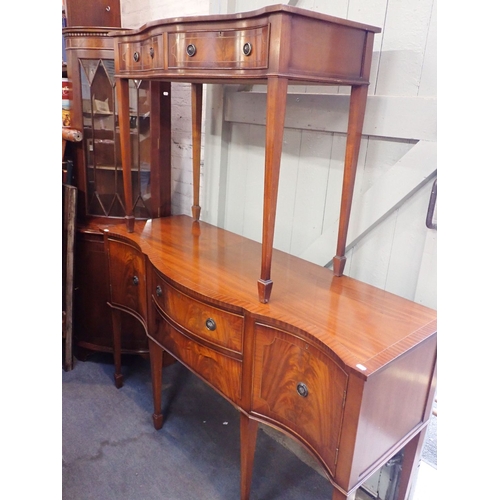 809 - A REPRODUCTION MAHOGANY SERPENTINE FRONTED SIDE TABLE OF GEORGIAN DESIGN fitted two drawers, 86cm hi... 