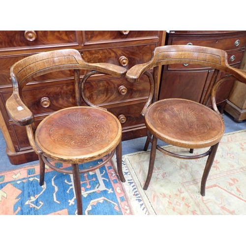 810 - A PAIR OF BENTWOOD ARMCHAIRS, IN THE STYLE OF THONET with round pressed plywood seats (unmarked)