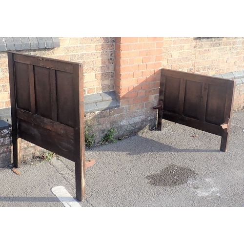 812 - AN OAK PANELLED SINGLE BED made from 18th century panelling (with iron rails)