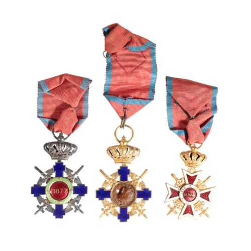 373 - A COLLECTION OF ROMANIAN ORDERS Order of the Star of Romanian, Knight grade with swords.

Condition ... 