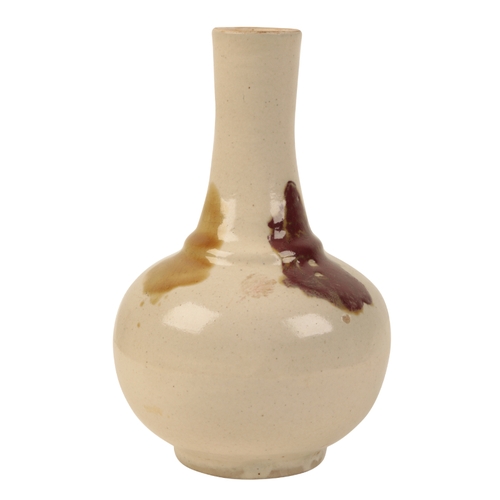 109 - A CHINESE CREAM GLAZED POTTERY BOTTLE VASE probably Qing, decorated with three coloured splashes, im... 