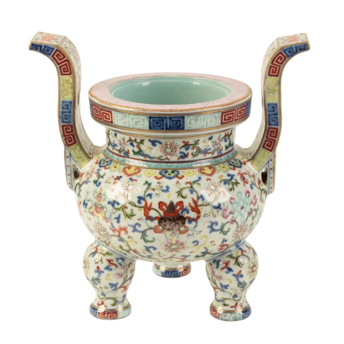 111 - A FINE CHINESE FAMILLE ROSE TRIPOD INCENSE BURNER Qing or later, enamelled in polychrome with Buddhi... 