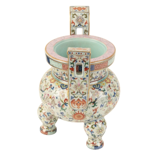 111 - A FINE CHINESE FAMILLE ROSE TRIPOD INCENSE BURNER Qing or later, enamelled in polychrome with Buddhi... 