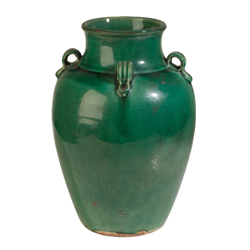 112 - A GUANGDON GREEN GLAZED POTTERY VASE Qing or later, with four ribbed lug handles, 26cm