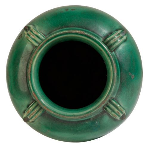 112 - A GUANGDON GREEN GLAZED POTTERY VASE Qing or later, with four ribbed lug handles, 26cm