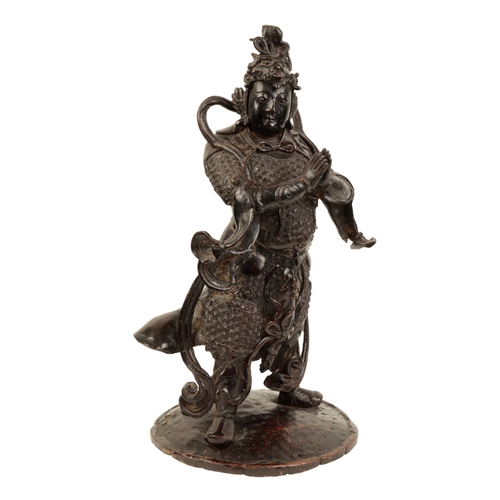 12 - A CHINESE BRONZE STANDING FIGURE OF GUANDI Ming, 16th/17th century, in full armour and elaborate hea... 