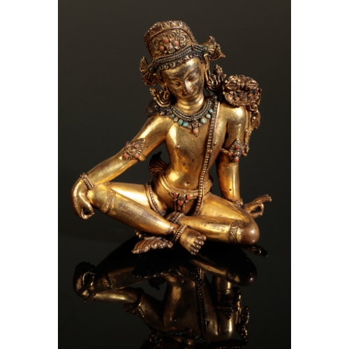 13 - A SINO-TIBETAN GILT BRONZE FIGURE OF INDRA Early Ming or later, seated in lalitasana, his right hand... 