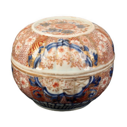 131 - A JAPANESE BOX AND COVER Edo, the moulded cushion shaped box decorated with underglaze blue, iron-re... 