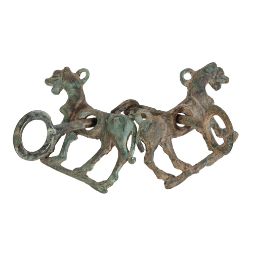 141 - A LURISTAN BRONZE HORSE BIT AND CHEEK PIECES each modelled as a standing horse, 8th/7th century BC.
... 