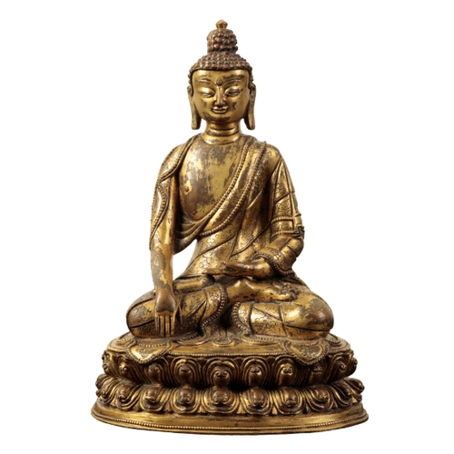 17 - A SINO-TIBETAN GILT BRONZE BUDDHA Ming or later, probably depicting Shakyamuni seated in Dhyanasana ... 