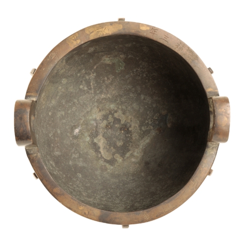 22 - A CHINESE BRONZE TRIPOD DING inscribed on the rim 