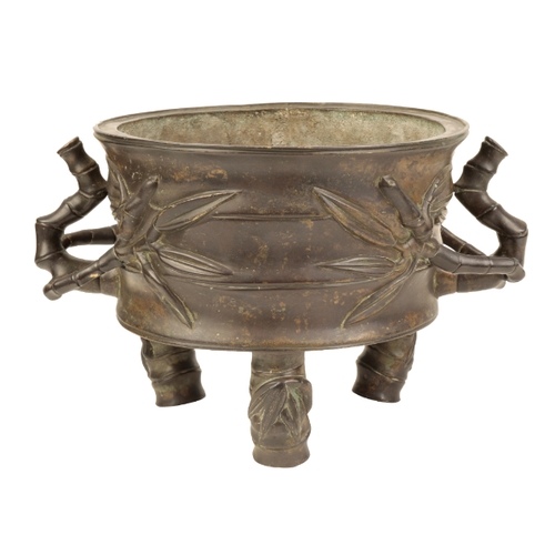 24 - A LARGE CHINESE BRONZE BAMBOO FORM CENSER early Qing, of squat cylindrical shape, the handles and fe... 