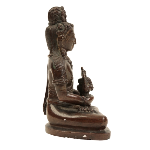 28 - A NEPALESE  BRONZE FIGURE OF AMITAYUS Qing or later, sitting cross legged on a shaped base, 9.5cm hi... 