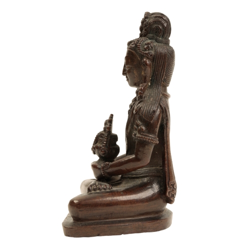 28 - A NEPALESE  BRONZE FIGURE OF AMITAYUS Qing or later, sitting cross legged on a shaped base, 9.5cm hi... 