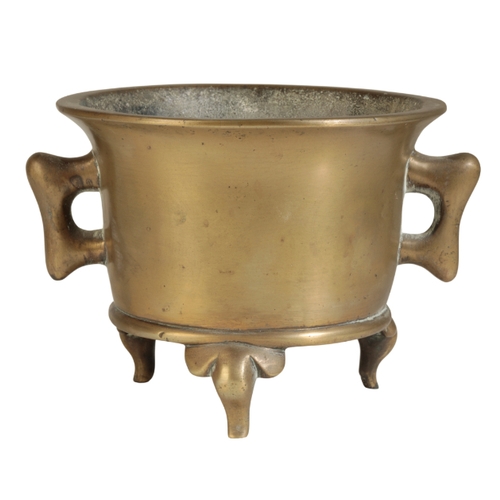 30 - A CHINESE BRONZE CENSER Qing or later, of flared form with two handles and on three elephants head f... 