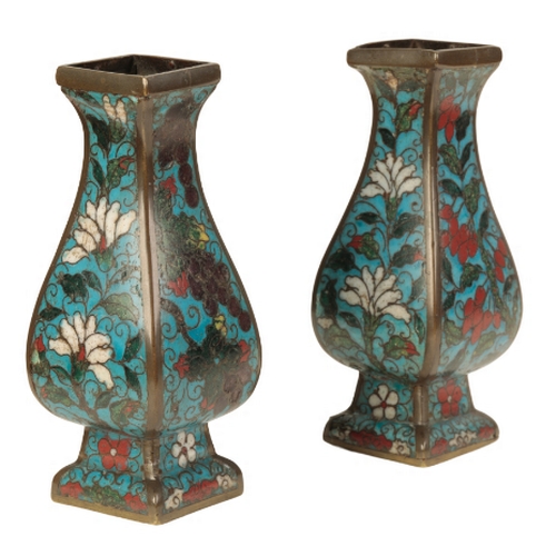 34 - A PAIR OF CHINESES CLOISONNE SQUARE VASES late Ming, of baluster form decorated with flowers on a bl... 