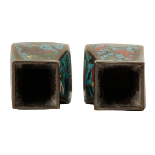 34 - A PAIR OF CHINESES CLOISONNE SQUARE VASES late Ming, of baluster form decorated with flowers on a bl... 