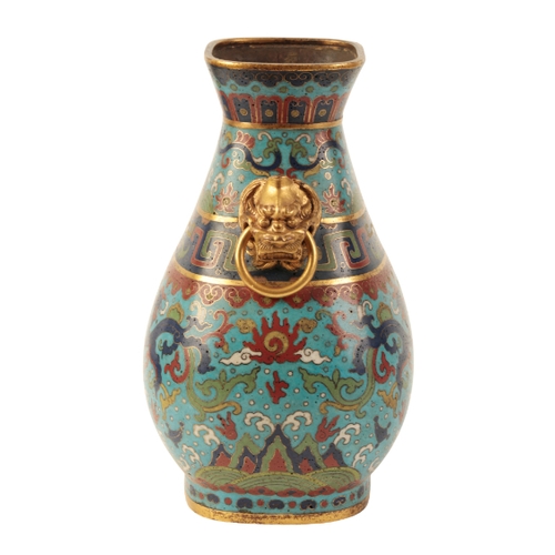 36 - A FINE CHINESE CLOISONNE HU-SHAPED VASE with gilt lion mask and loose ring handles, decorated with g... 