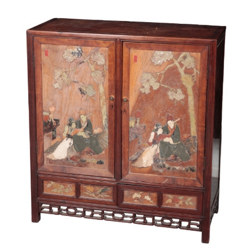 4 - A CHINESE HARDWOOD AND SOAPSTONE INLAID CABINET Qing or later, each of the panelled doors with inset... 