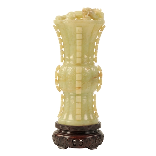 50 - A CHINESE YELLOW JADE ARCHAISTIC VASE probably early Qing, carved with a chilong around the rim, 20c... 