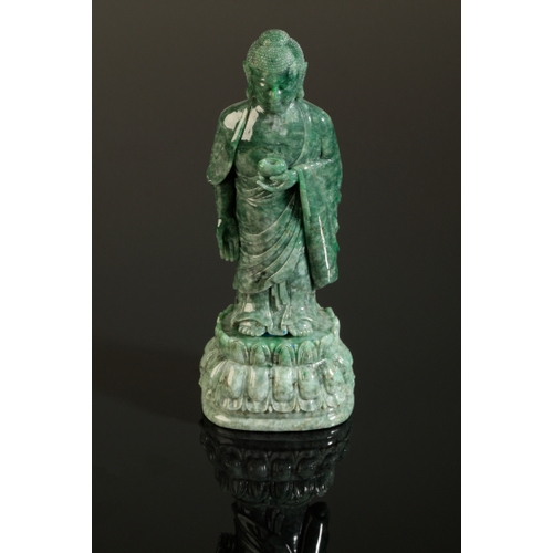 51 - A CHINESE MOTTLED GREEN JADEITE BUDDHA probably late Qing, with a fine polish, the standing figure o... 