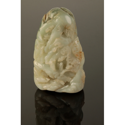 52 - A CHINESE CELADON JADE BOULDER  Carved as a mountain Qing or later, the stone with areas of russet a... 