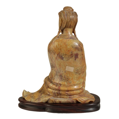 58 - A LARGE CHINESE SOAPSTONE GUANYIN probably early Qing, her finely carved hair piled into a chignon a... 