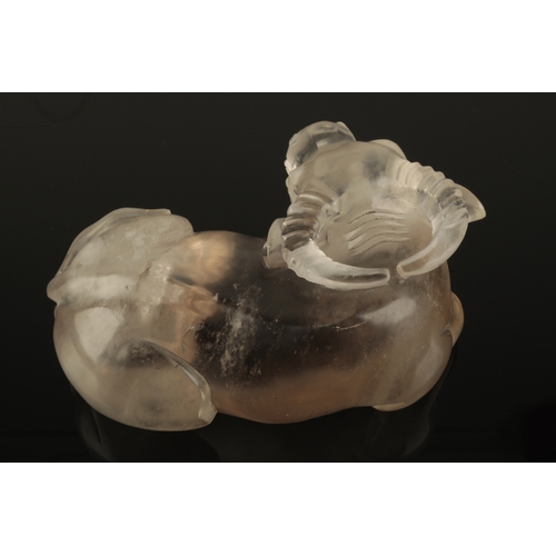 59 - A CHINESE ROCK CRYSTAL BUFFALO probably Qing, the recumbent beast modelled with head turned, 15cm lo... 