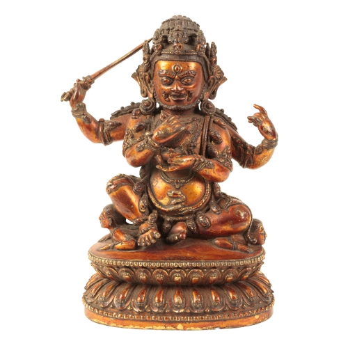 61 - A SINO-TIBETAN LACQUERED GILT BRONZE FIGURE OF A GUARDIAN Ming or later, holding a sword in one of t... 