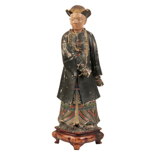 66 - A LARGE CHINESE PAINTED PLASTER âNODDING HEADâ FIGURE Qing, probably circa 1820, the standing ma... 