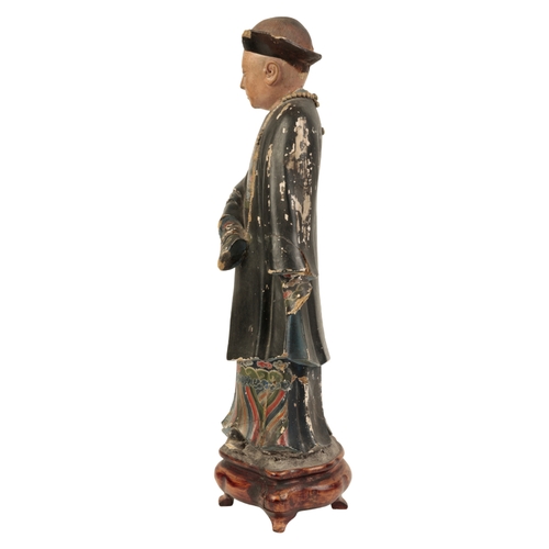 66 - A LARGE CHINESE PAINTED PLASTER âNODDING HEADâ FIGURE Qing, probably circa 1820, the standing ma... 