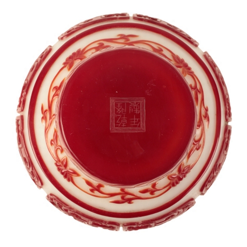 68 - A 'BEIJING' WHITE AND RED OVERLAY GLASS VASE probably Qing, decorated with archaistic dragon panels ... 