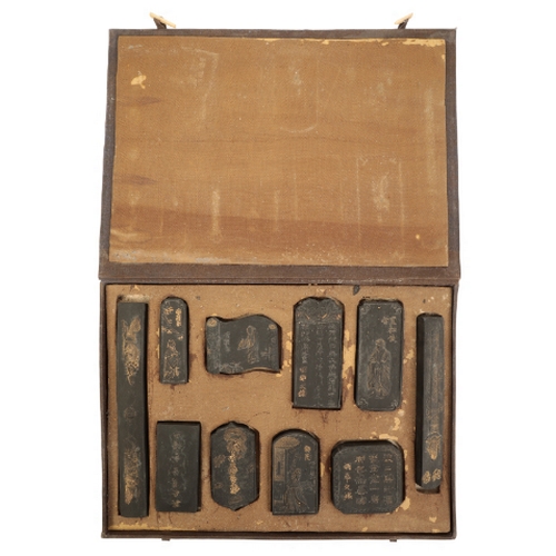 69 - A CASED SET OF TEN CHINESE INKSTONES Qing or later, the decoration highlighted in gilt, the longest ... 