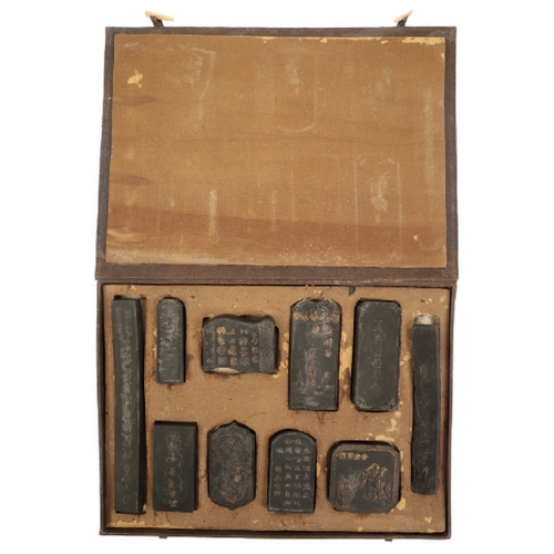 69 - A CASED SET OF TEN CHINESE INKSTONES Qing or later, the decoration highlighted in gilt, the longest ... 