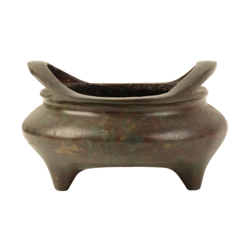 7 - A CHINESE BRONZE TWO-HANDLED TRIPOD CENSER the base with a Xuande four-character mark, the surface w... 