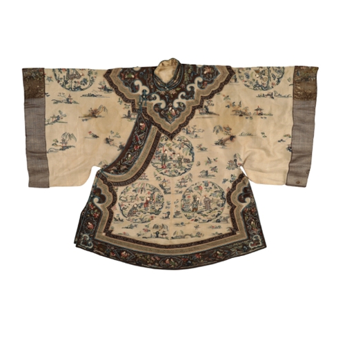 70 - A CHINESE IVORY SILK SHORT ROBE probably late Qing, embroidered with figures in roundels and landsca... 