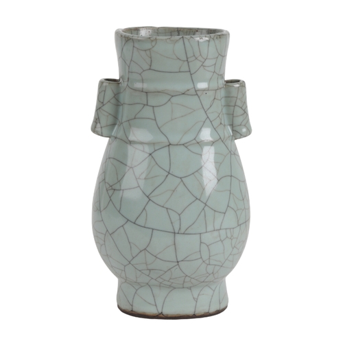 78 - A CHINESE CELADON VASE in the Song style, of archaic form covered in a pale celadon 