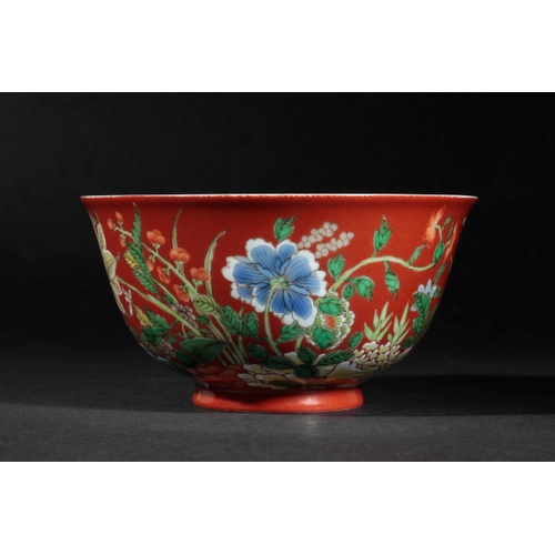 84 - A FINE CHINESE CORAL-GROUND BOWL the exterior vividly painted with flowers in polychrome enamels on ... 