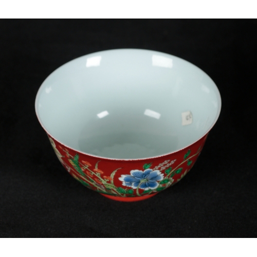 84 - A FINE CHINESE CORAL-GROUND BOWL the exterior vividly painted with flowers in polychrome enamels on ... 