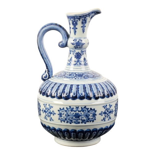 86 - A CHINESE BLUE AND WHITE EWER of Iznic form painted in shades of intense blue with scroll work and s... 