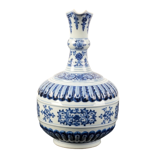 86 - A CHINESE BLUE AND WHITE EWER of Iznic form painted in shades of intense blue with scroll work and s... 