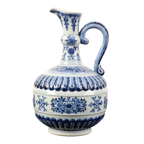 86 - A CHINESE BLUE AND WHITE EWER of Iznic form painted in shades of intense blue with scroll work and s... 