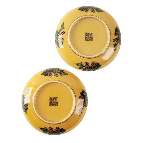 90 - A PAIR OF CHINESE YELLOW-GROUND DRAGON PLATES decorated with five claw dragons contesting flaming pe... 