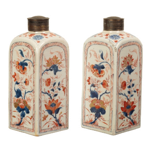 96 - A PAIR OF CHINESE 'IMARI' CANISTERS early Qing, painted with panels of flowers within diaper zig-zag... 