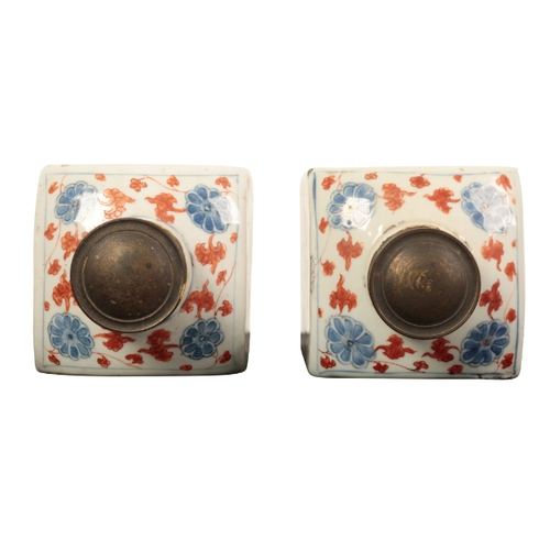 96 - A PAIR OF CHINESE 'IMARI' CANISTERS early Qing, painted with panels of flowers within diaper zig-zag... 