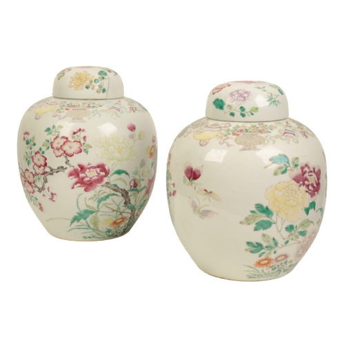 99 - A PAIR OF CHINESE FAMILLE ROSE JARS AND COVERS Qing, enamelled in polychrome with flowers issuing fr... 