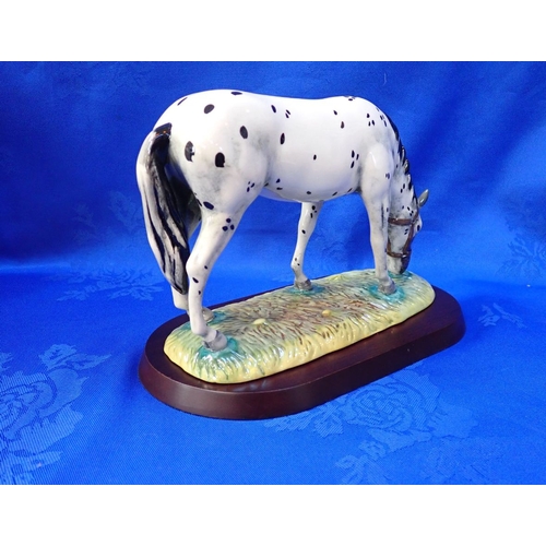 295 - A ROYAL DOULTON POTTERY FIGURE - 'APPALOOSA' from the Horse and Pony Collection RDA32, with stand an... 