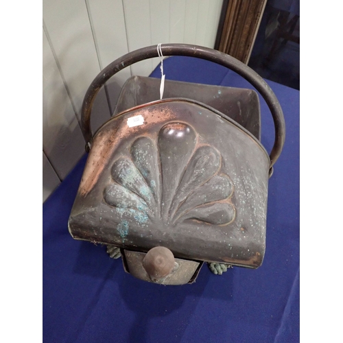 33 - A COPPER COAL SCUTTLE late Victorian, with lion feet, and brass shovel