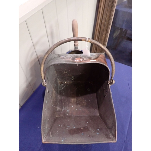 33 - A COPPER COAL SCUTTLE late Victorian, with lion feet, and brass shovel