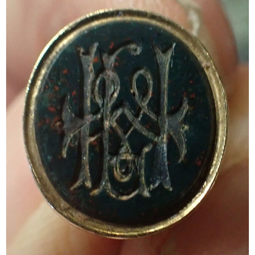 446 - A GOLD COLOURED METAL AND BLOODSTONE SEAL modelled with a standing horse, initials engraved to matri... 